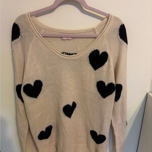Chic Cream Sweater with Black Heart Accents